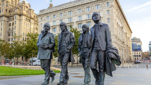 Statue of the Beatles outside the Royal Liver Building in Liverpool, UK.